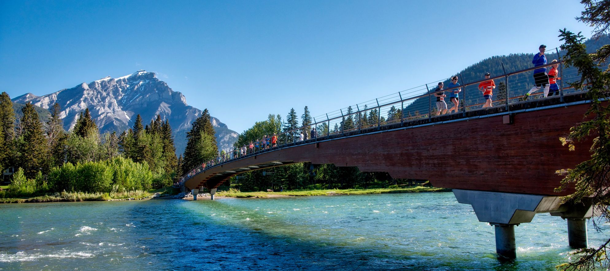 Running along the Banff pedestrian bridge