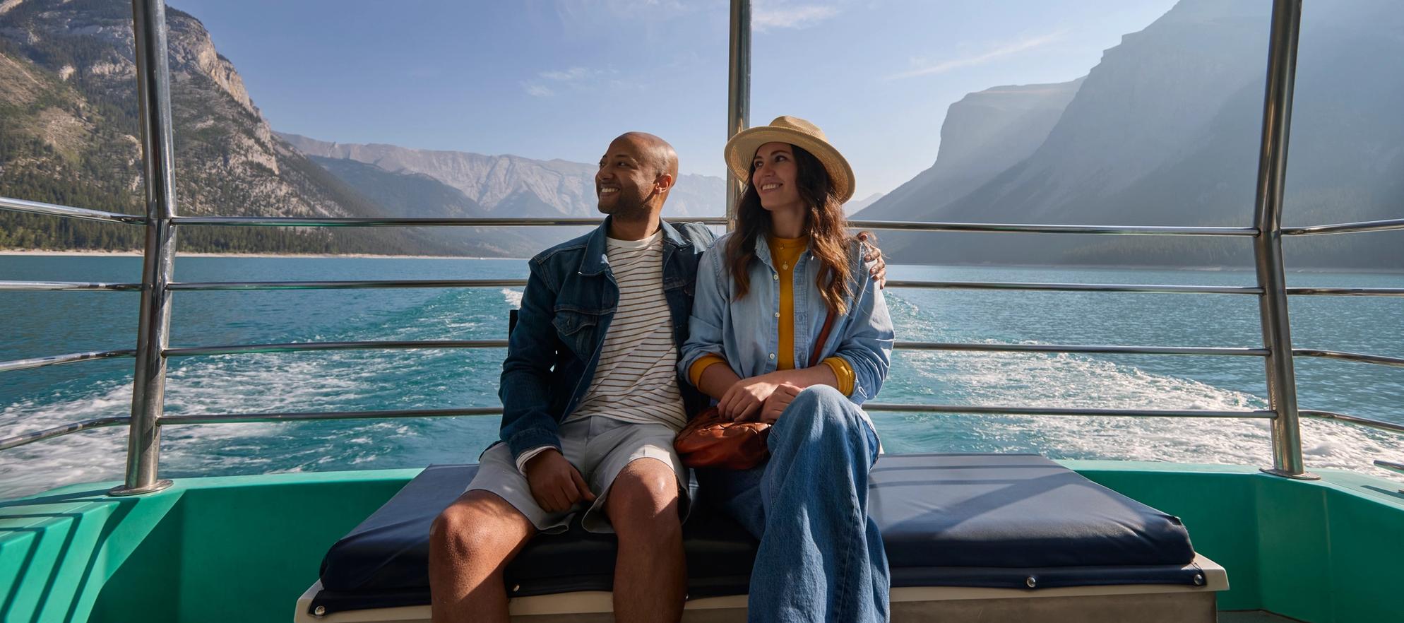 Two people on the Minnewanka Boat Cruise in Banff National Park.