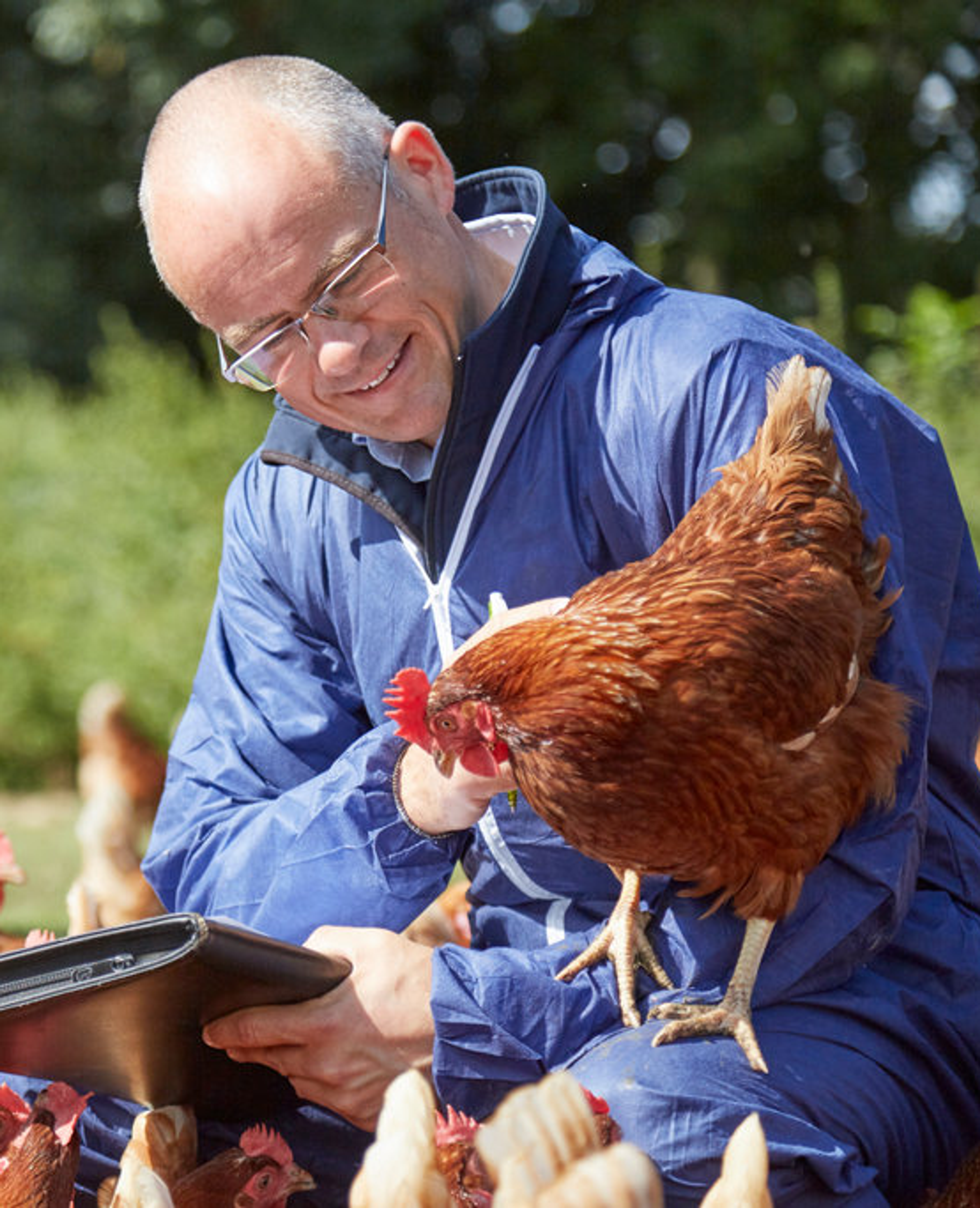 RSPCA Assured assessor and hens outside