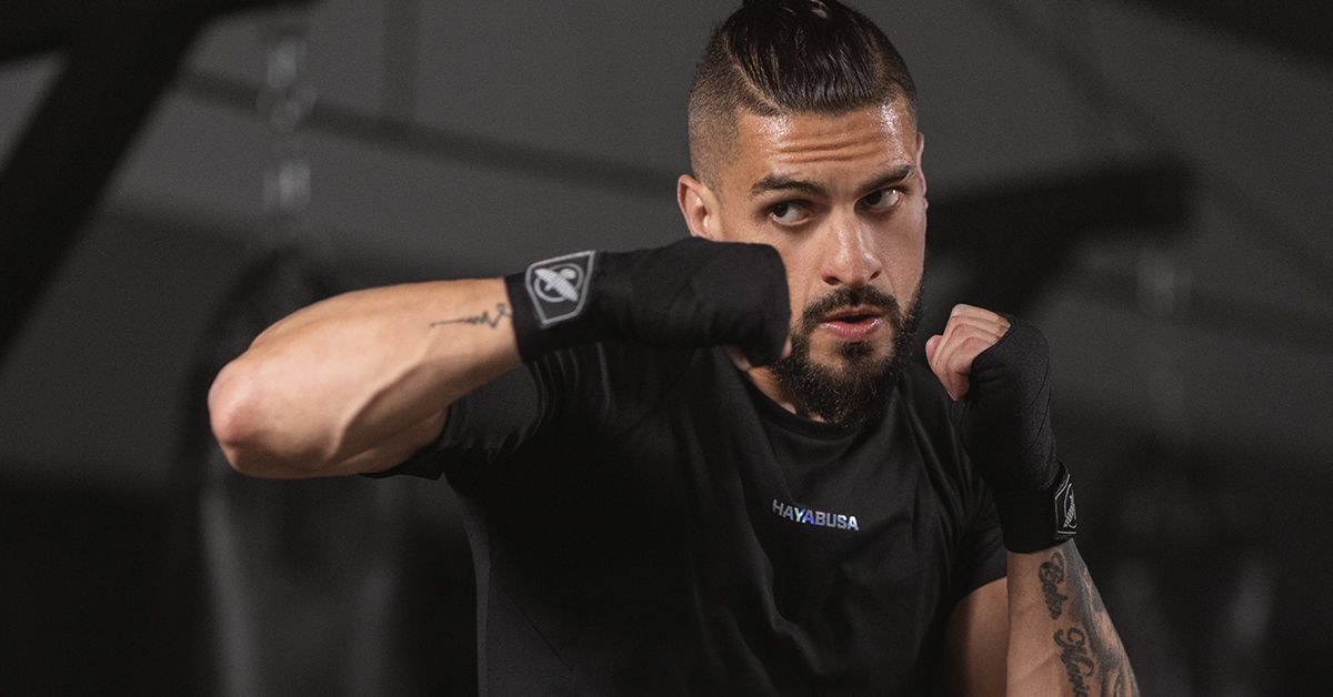 The fighter's hands are wrapped to protect hand wraps for injury