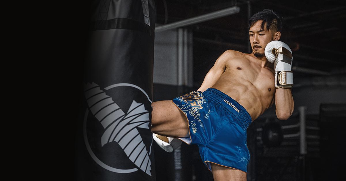 Kickboxing exercise with Hayabusa kickboxing gloves and a punching bag for physical and mental health