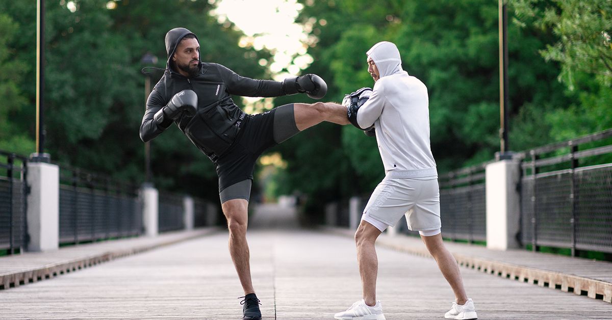 Two men wearing Hayabusa Boxing Apparel in a training session