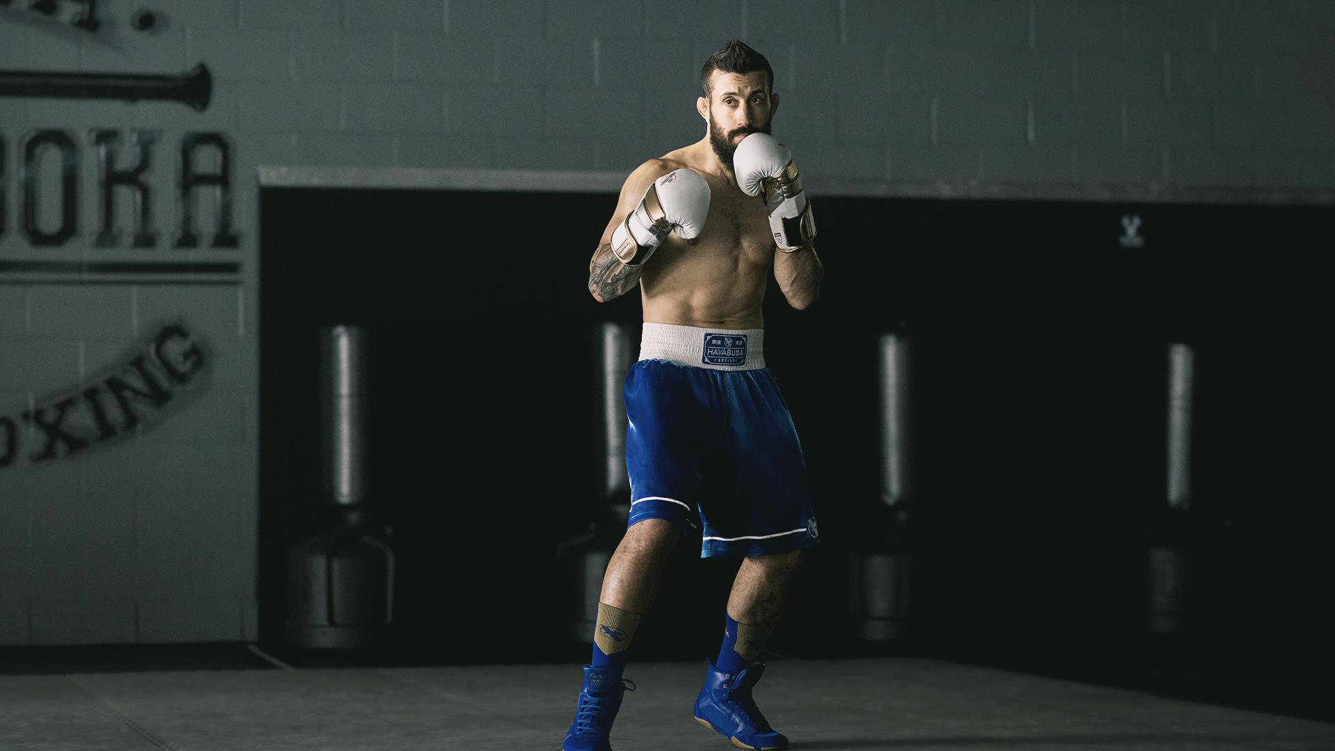 Reinforced stitching ensures durability, while wide leg openings offer mobility for fighting