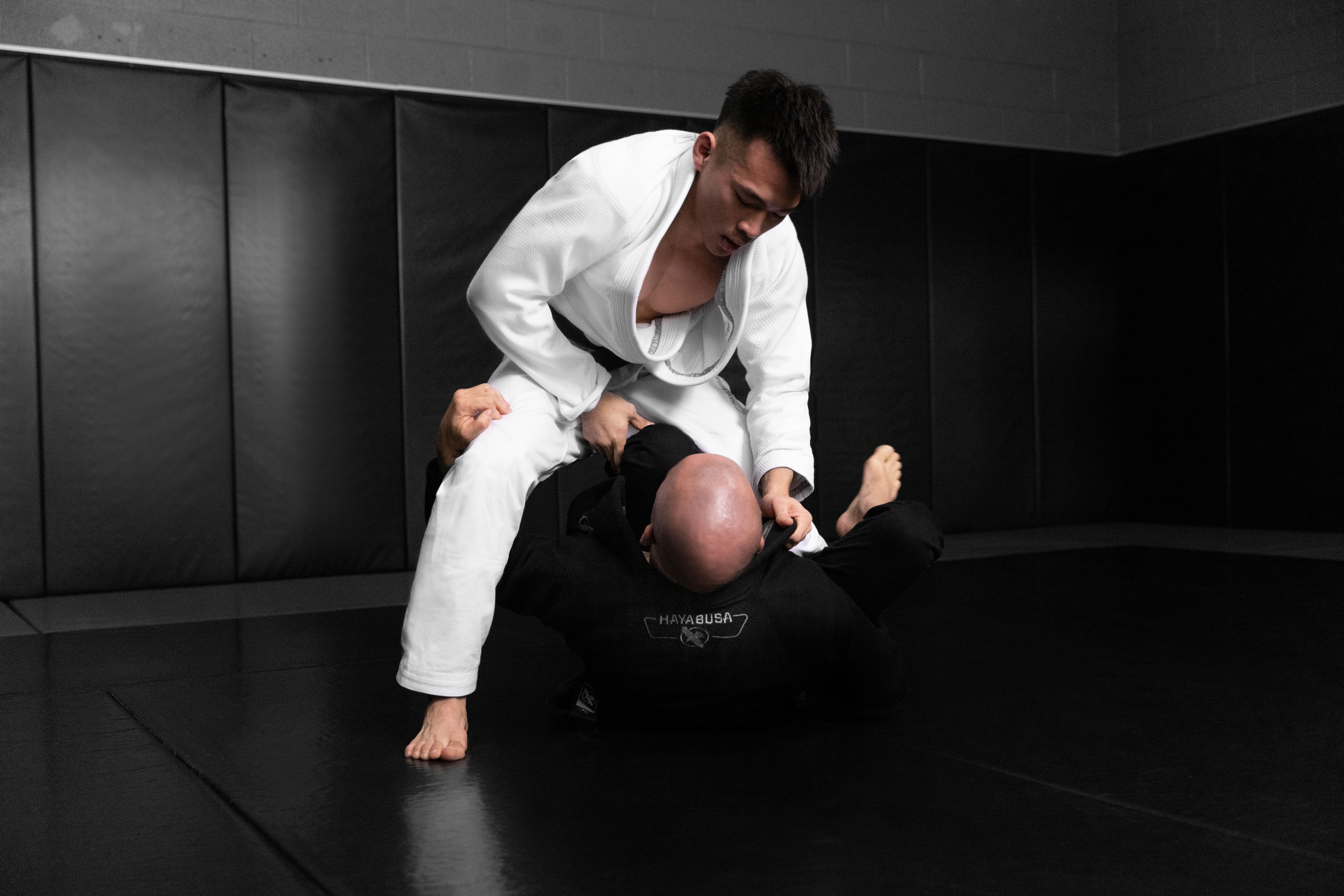 Two men in Hayabusa Essential Gold Weave Jiu-Jitsu Gi fighting.