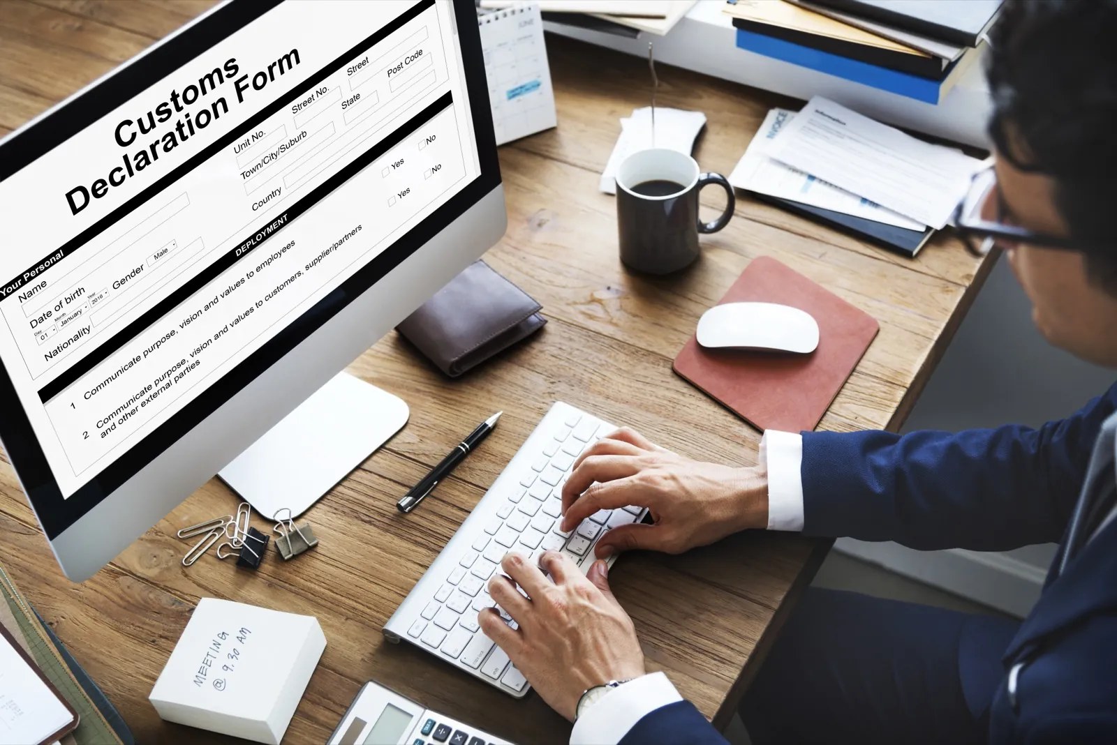 Customs declaration paperwork being completed at a desk