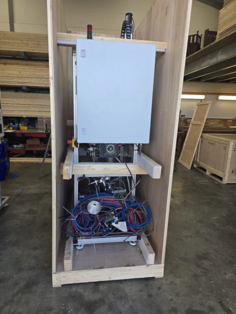 Control cabinet and pipework secured in a bespoke crate