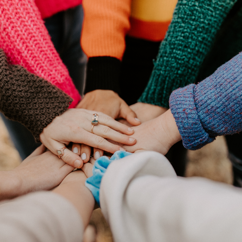 Women's hands together in a circle - Photo by Hannah Busing on Unsplash