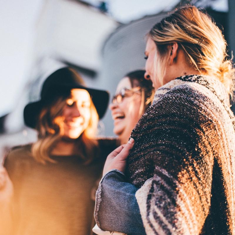 Three women laugh and joke. Photo by Priscilla Du Preez on Unsplash