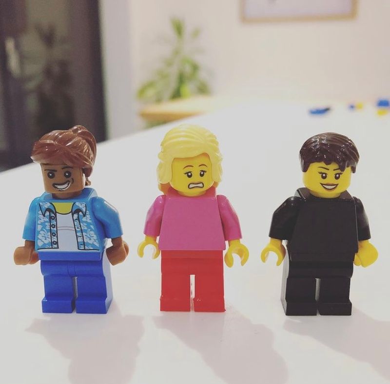 Three lego characters - one is looking worried