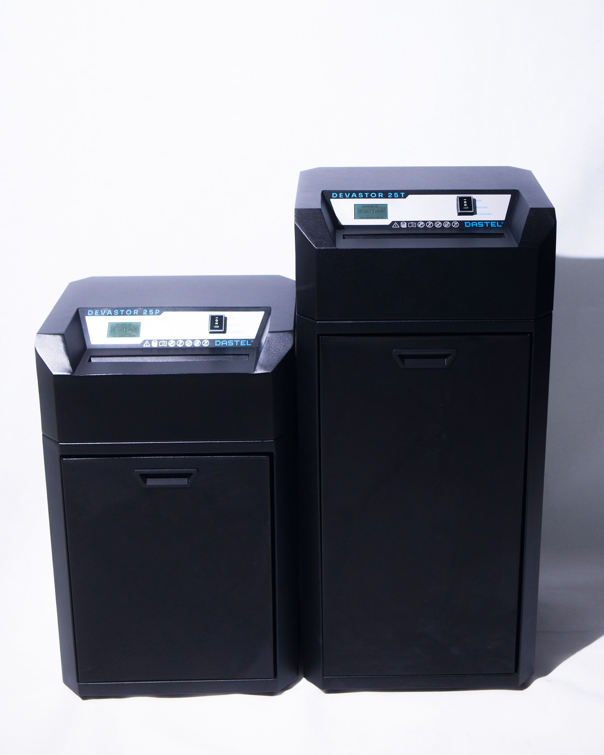 Two Dastel Devastor series industrial or commercial-grade document shredders, models 25P and 25T, in matte black, featuring digital displays and sturdy constructions.