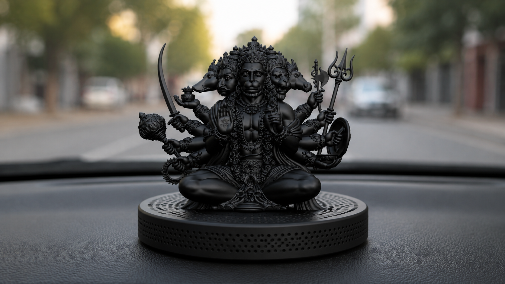 Black Panchamukhi Hanuman religious figurine with multiple heads and arms, holding various traditional weapons and objects, seated on a textured base, designed for display
