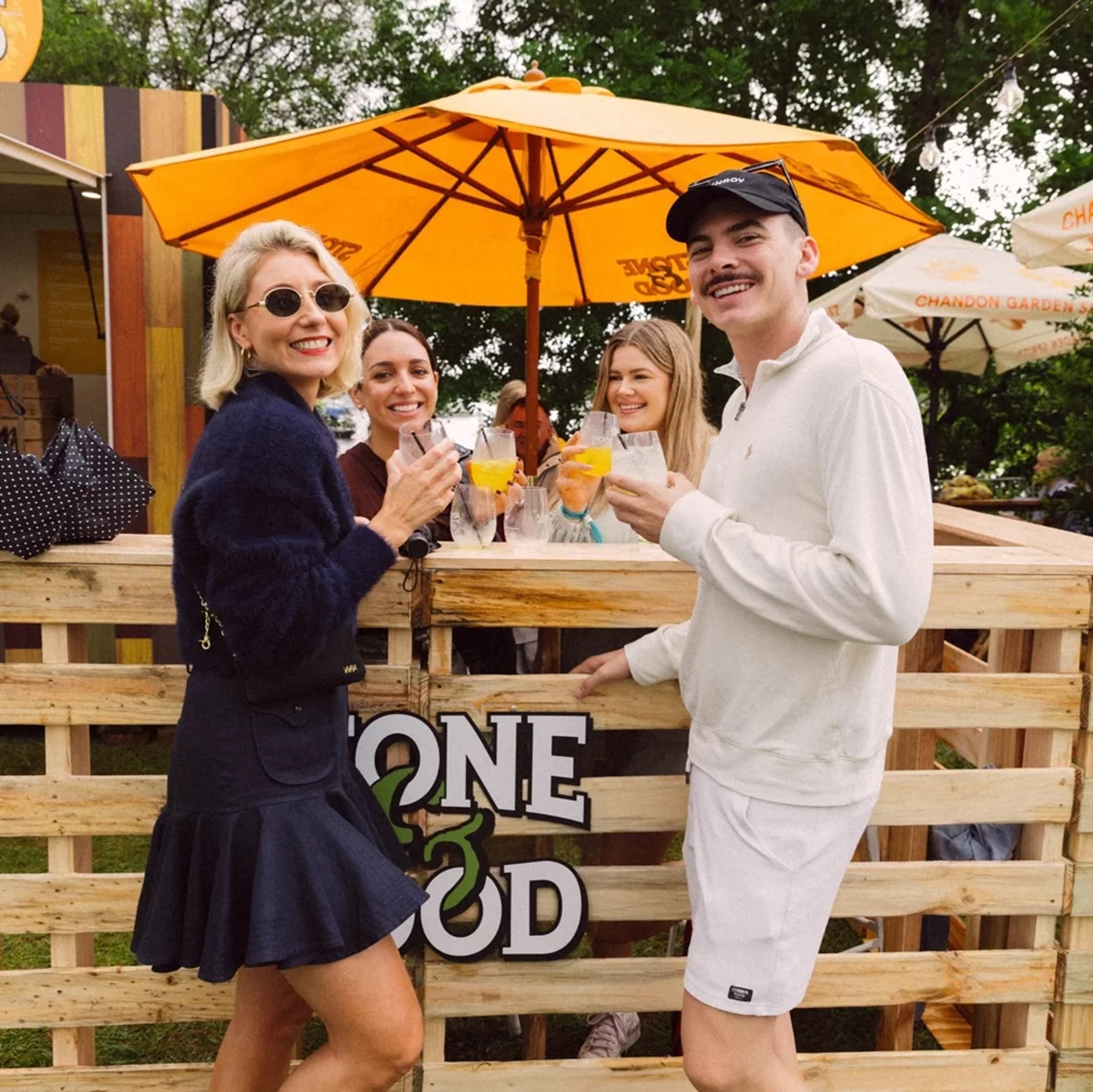 Stone & Wood Stand with Festival Goers