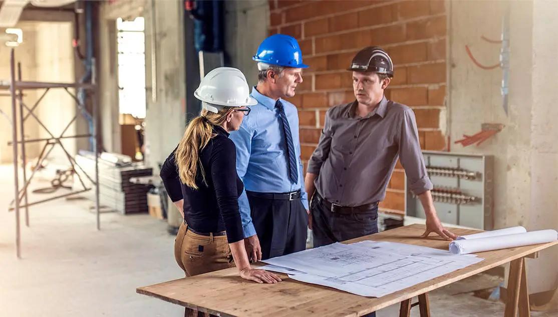 How does Dedicated Construction Management save $70,000 a year with a hotel booking platform?