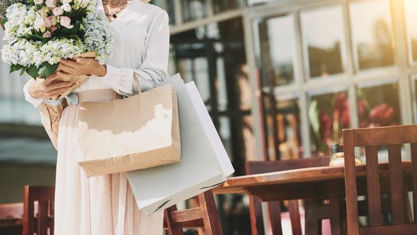 Are welcome bag delivery fees included or charged separately by hotels?