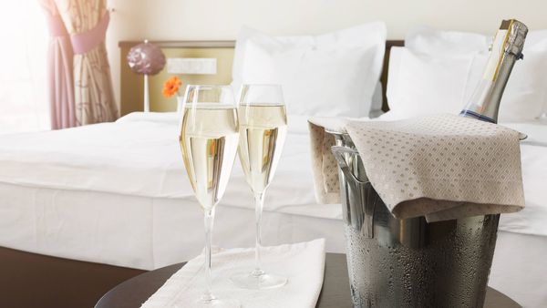 What fees in room block hotel proposals most often surprise couples?