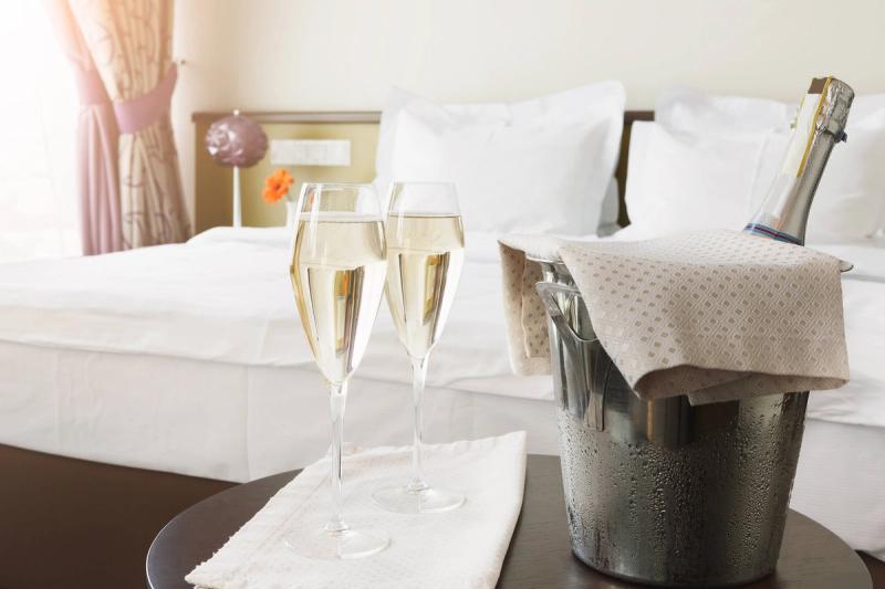 What fees in room block hotel proposals most often surprise couples?