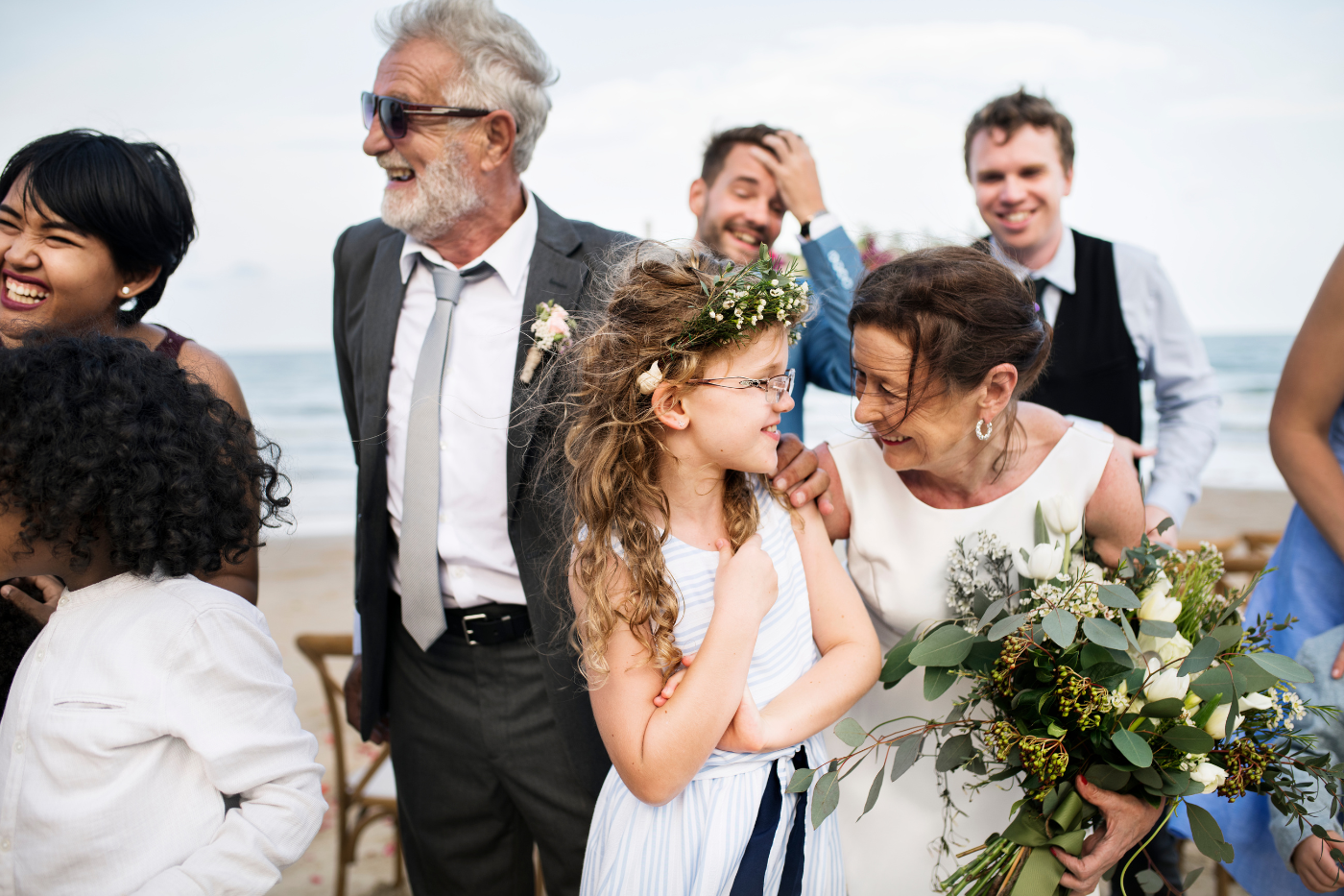 Wedding guests of different generations celebrating together at an outdoor wedding