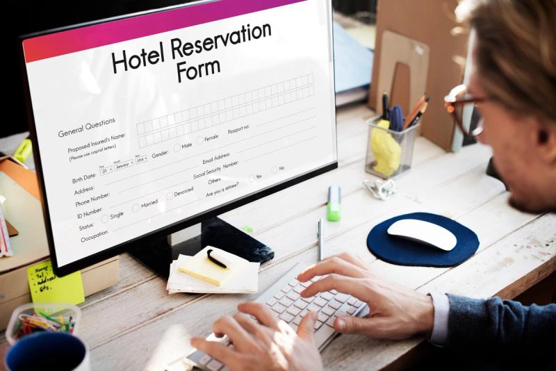 Should we reserve fewer rooms upfront and add more later, or book the full estimated amount from the start?