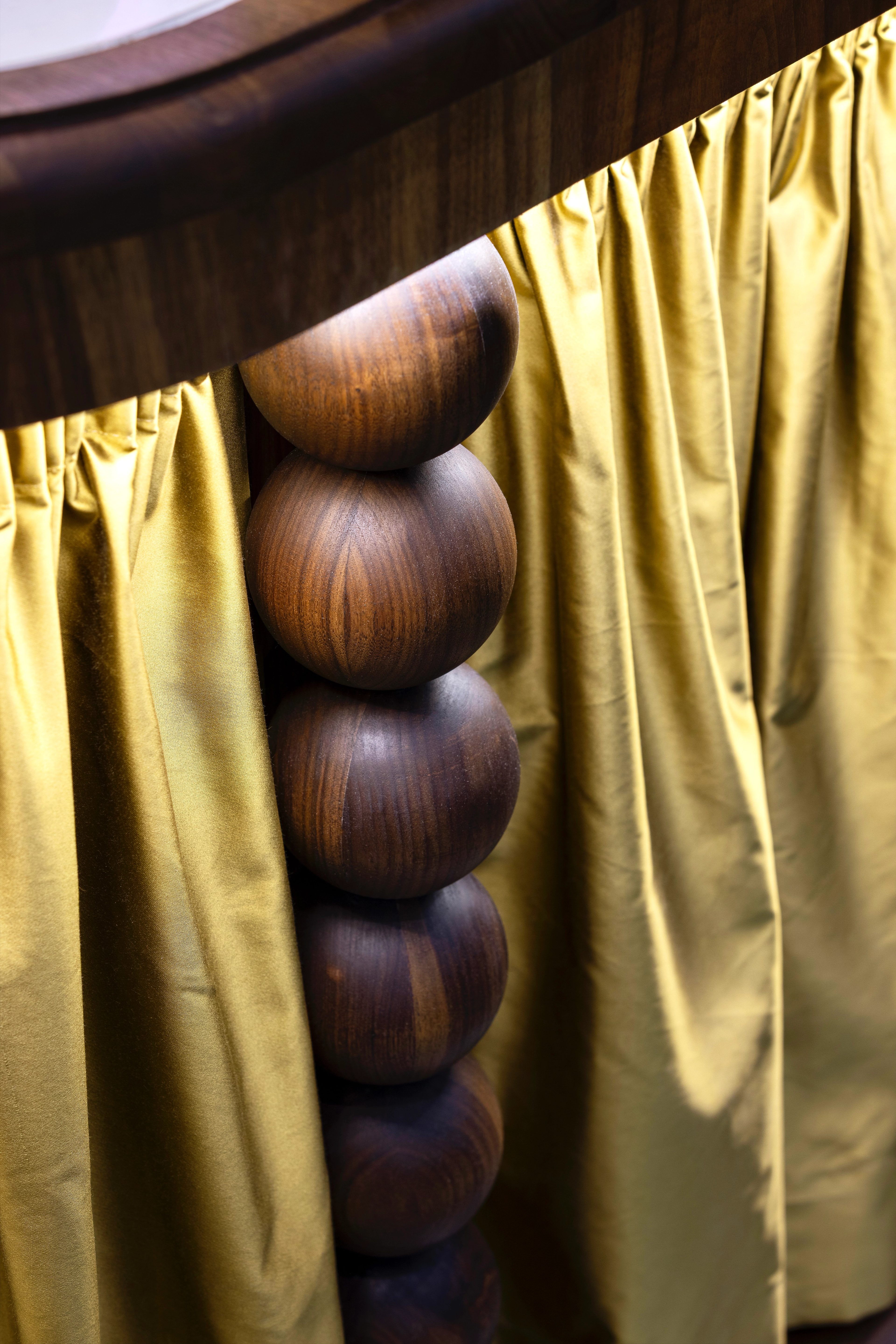 Counter detail with solid walnut balls & silk fabric