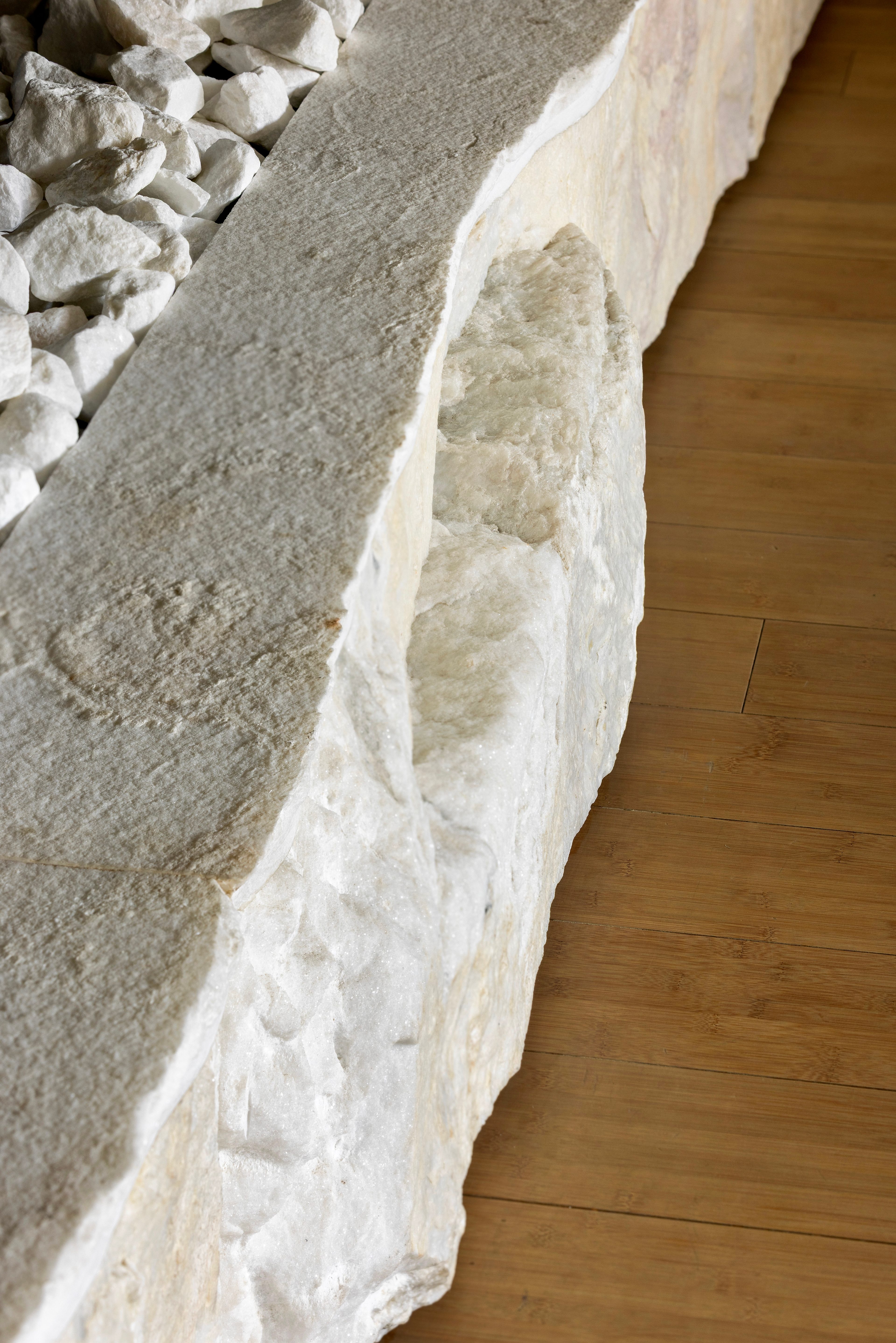 Living room's eight-metre raw Calacatta Zambia fireplace