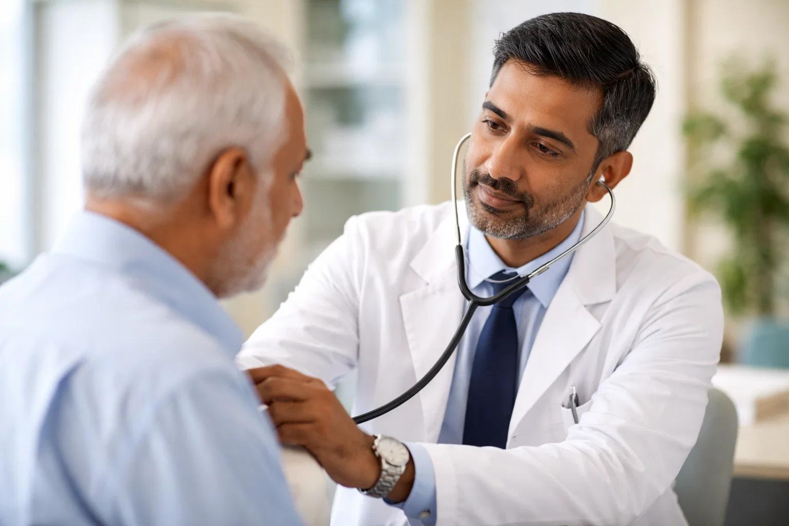 an indian doctor diagnosing patient