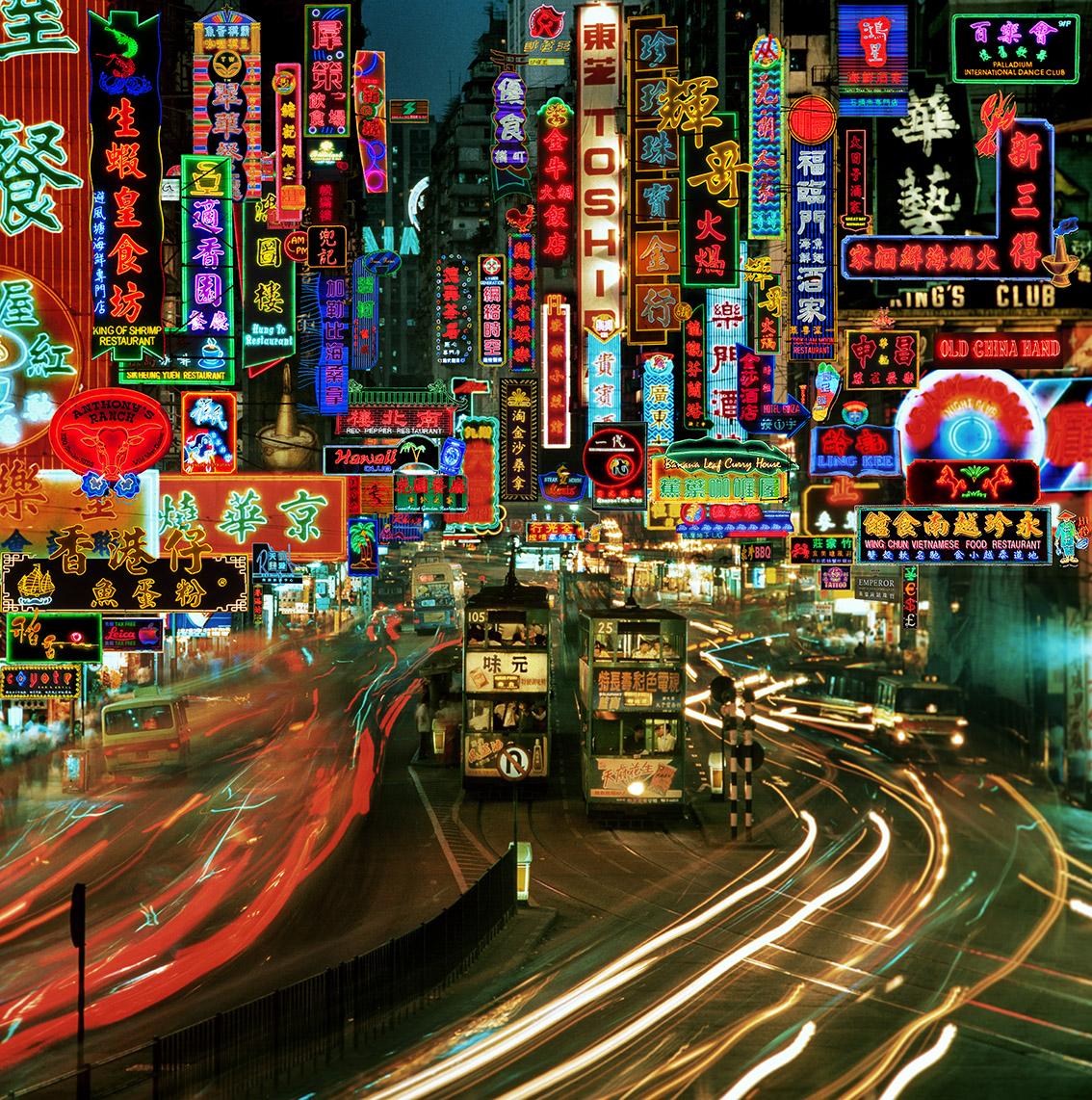 Neon-lit Hong Kong street packed with glowing signs, trams, and streaking traffic at night.