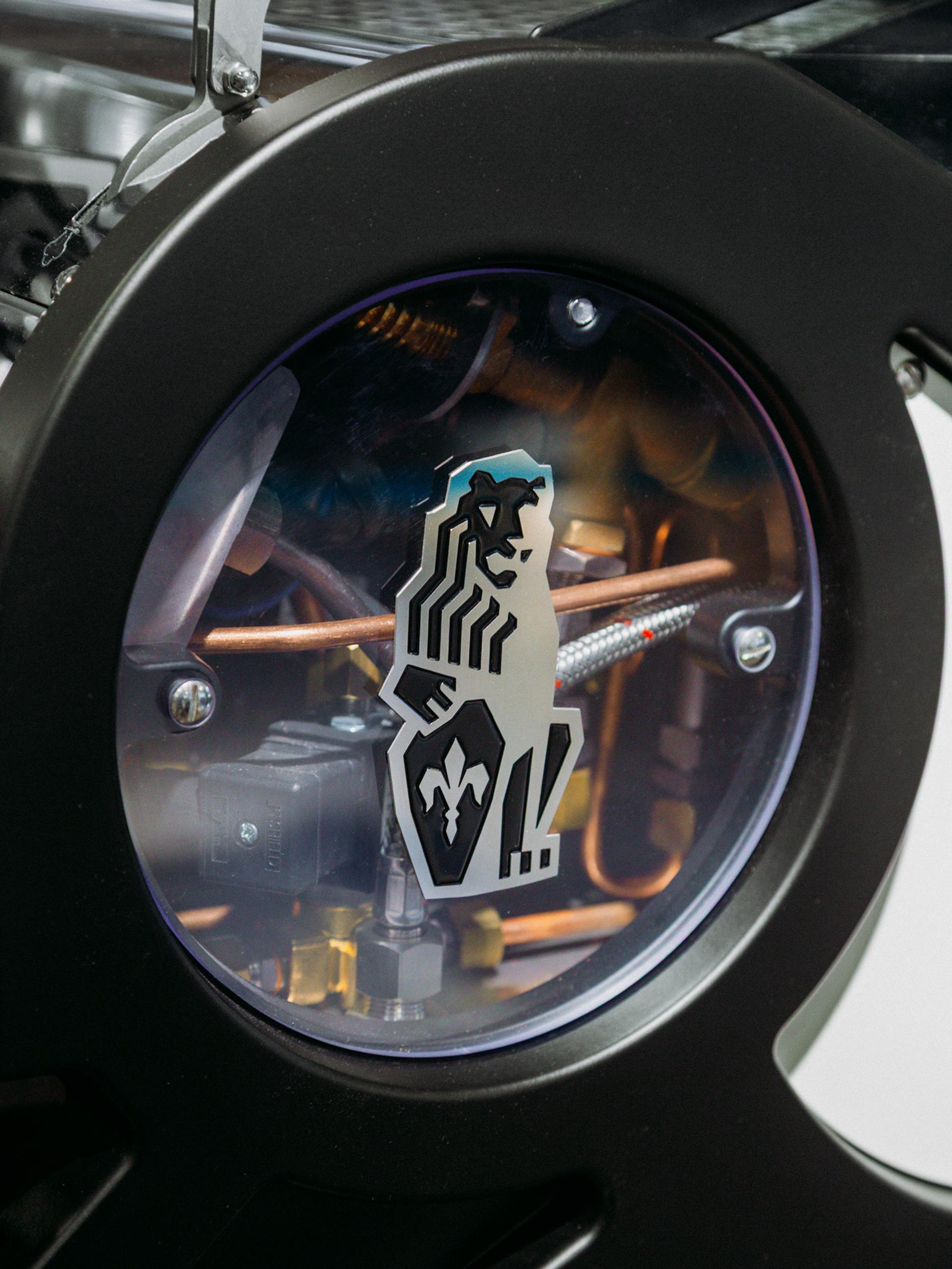 Close-up photo of the La Marzocco shield logo.