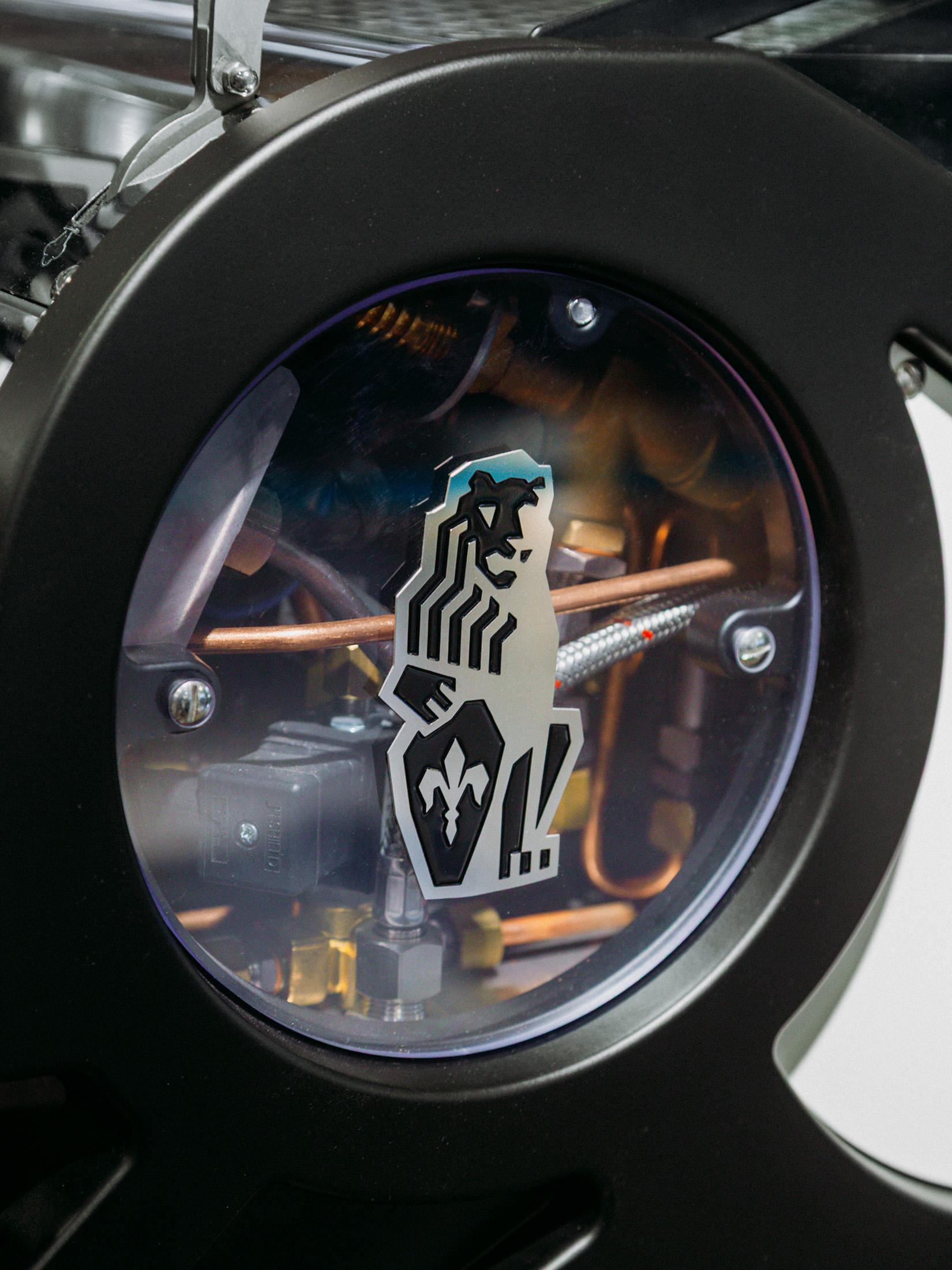 Close-up photo of the La Marzocco shield logo.