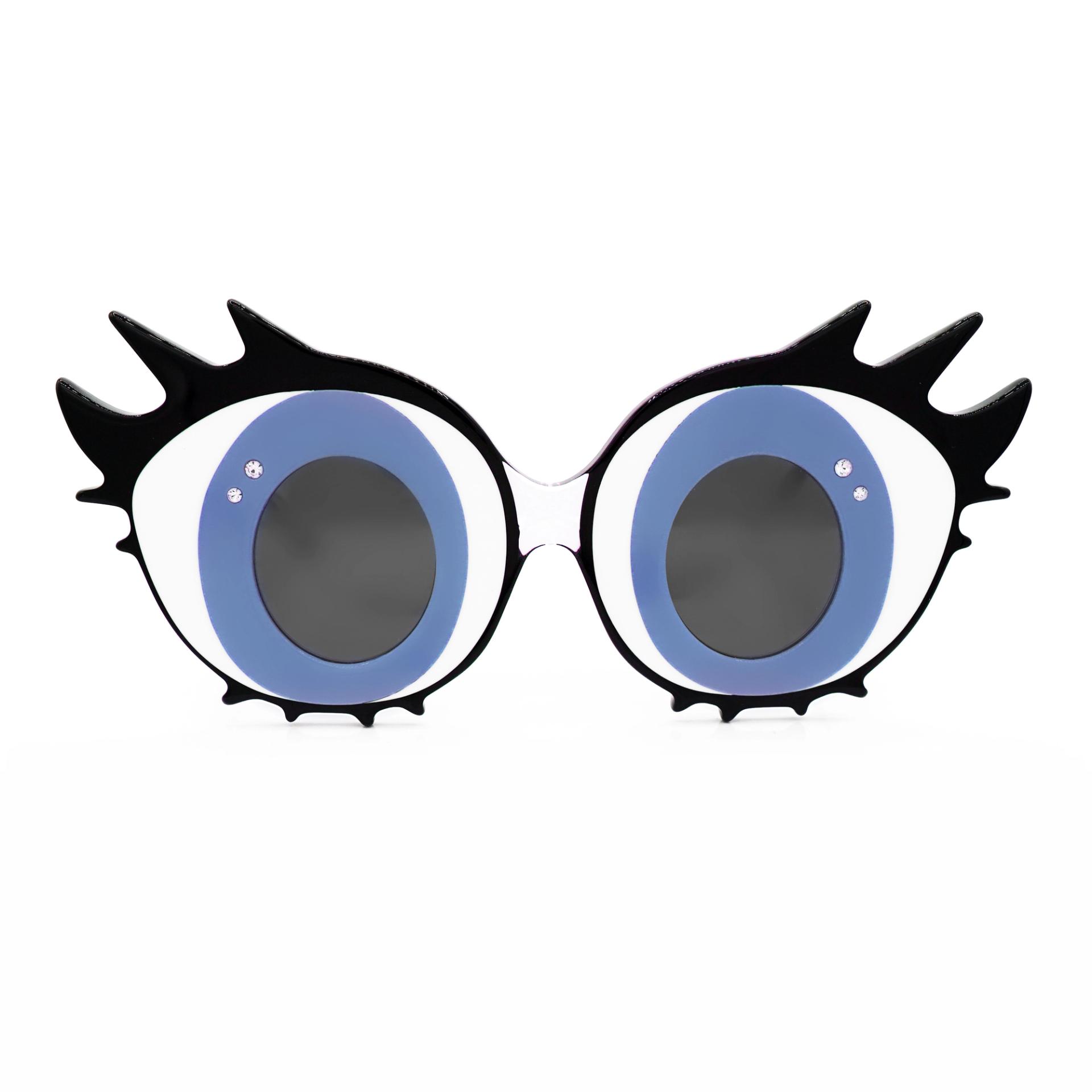 Dramatic sunglasses with lenses in the shape of blue cartoon eyes with black eyelashes, against a white background.