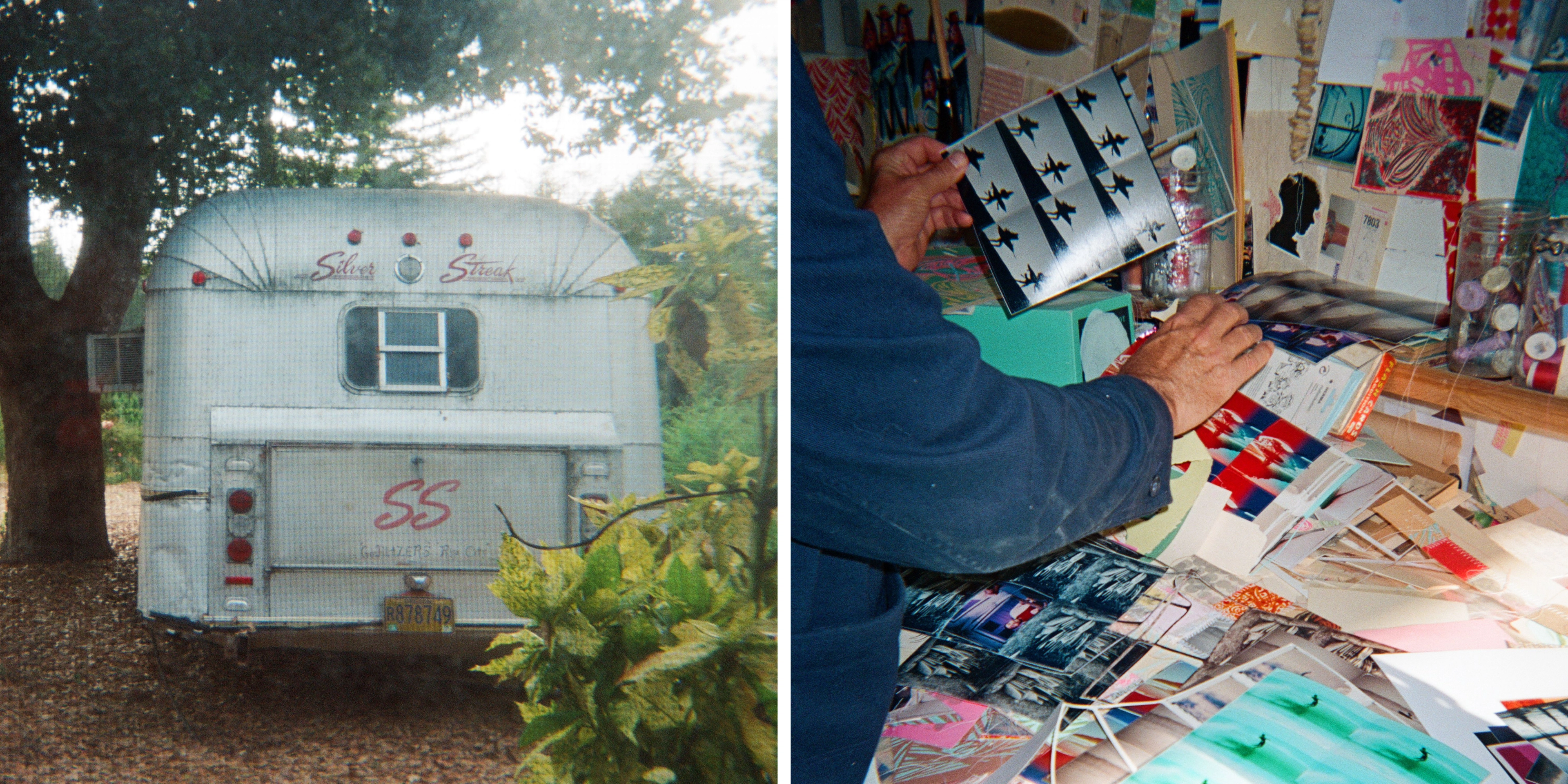 A vintage "Silver Streak" travel trailer with "SS" lettering on its rear door, parked on a gravel lot beneath leafy trees, its aluminum siding weathered and dull.; A person sorting through a cluttered studio table piled with colorful photos, prints, and collage materials, holding up one image while jars of trinkets sit on a shelf behind.
