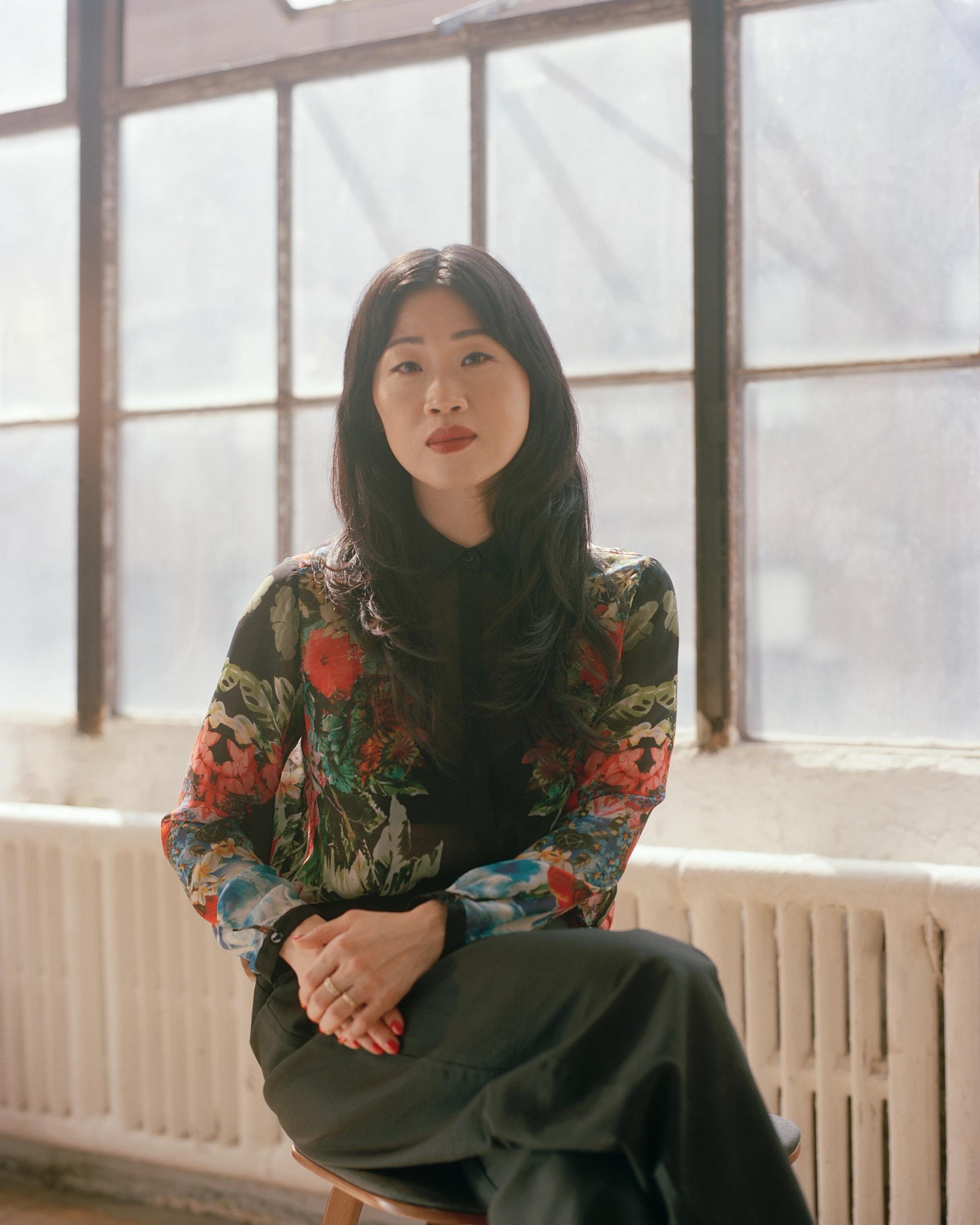 The author seated in a chair.