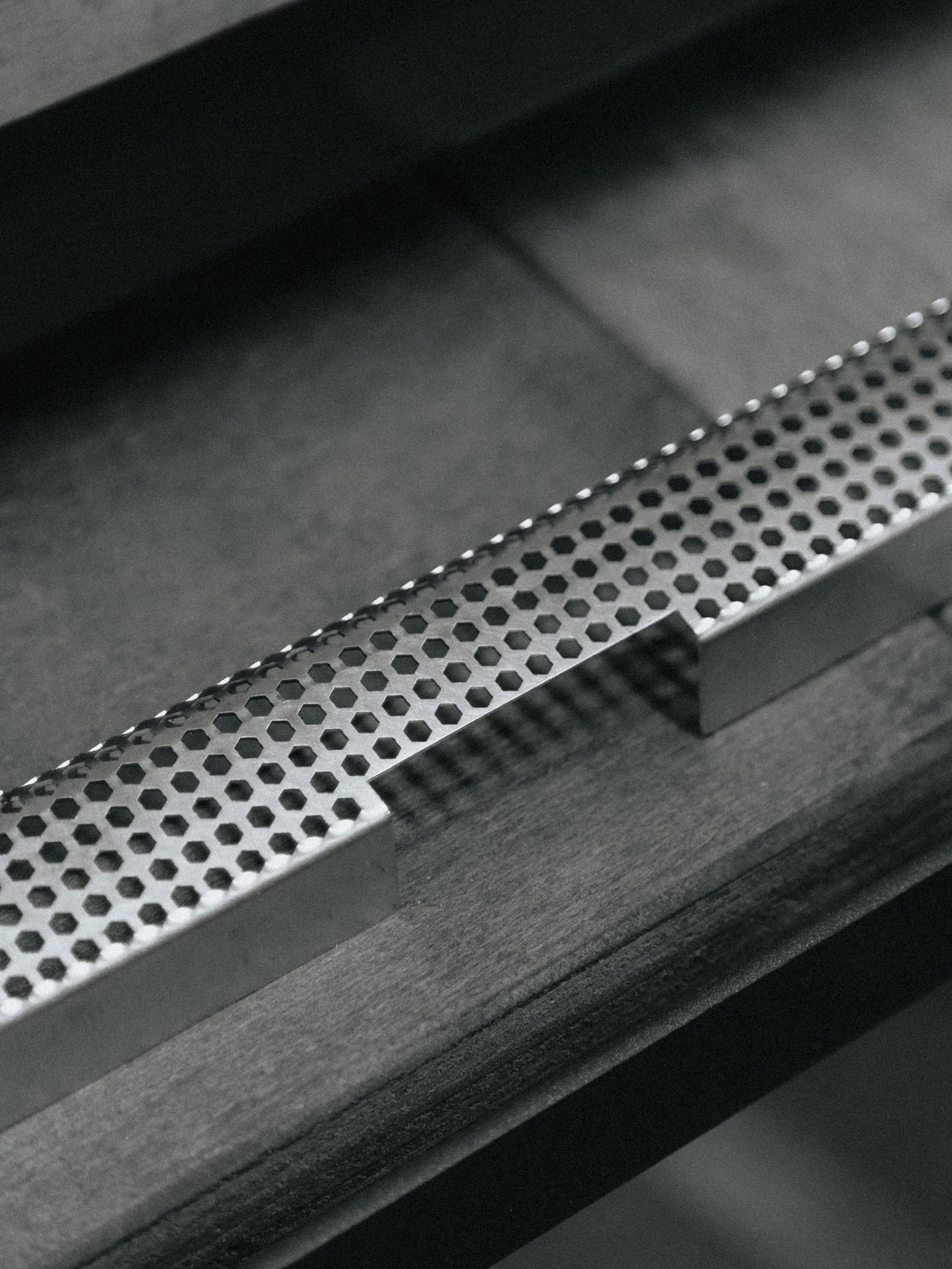 Cose-up photo of an espresso machine grate.