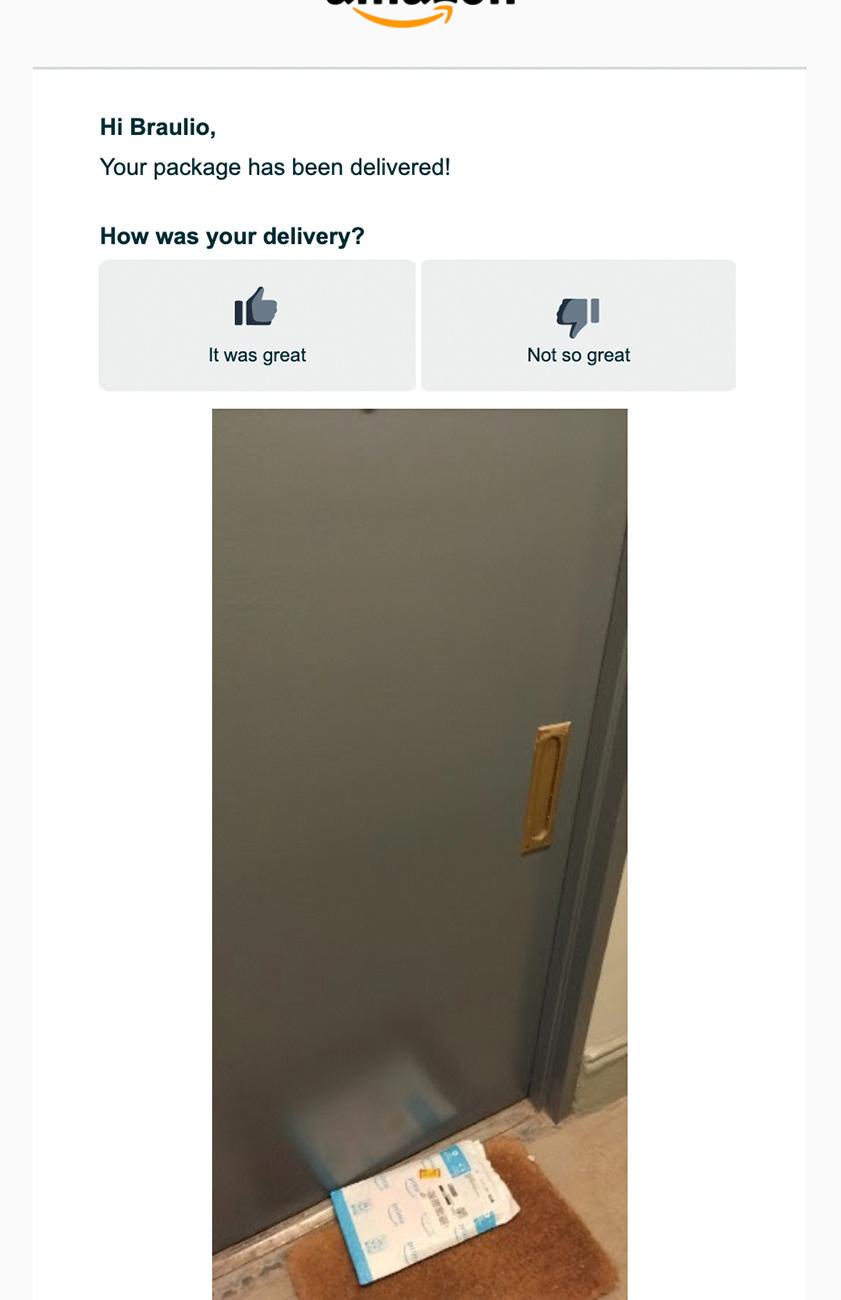 Screenshot of a delivery notification with a photo of an Amazon package sitting outside a door.