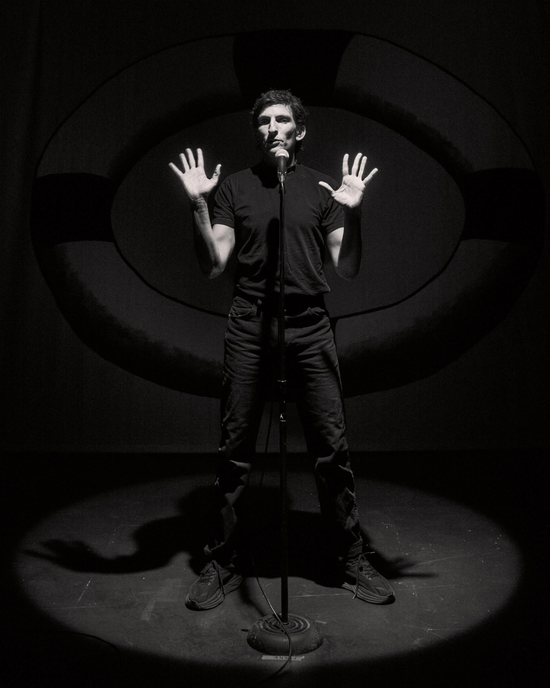Morgan Bassichis on stage. 