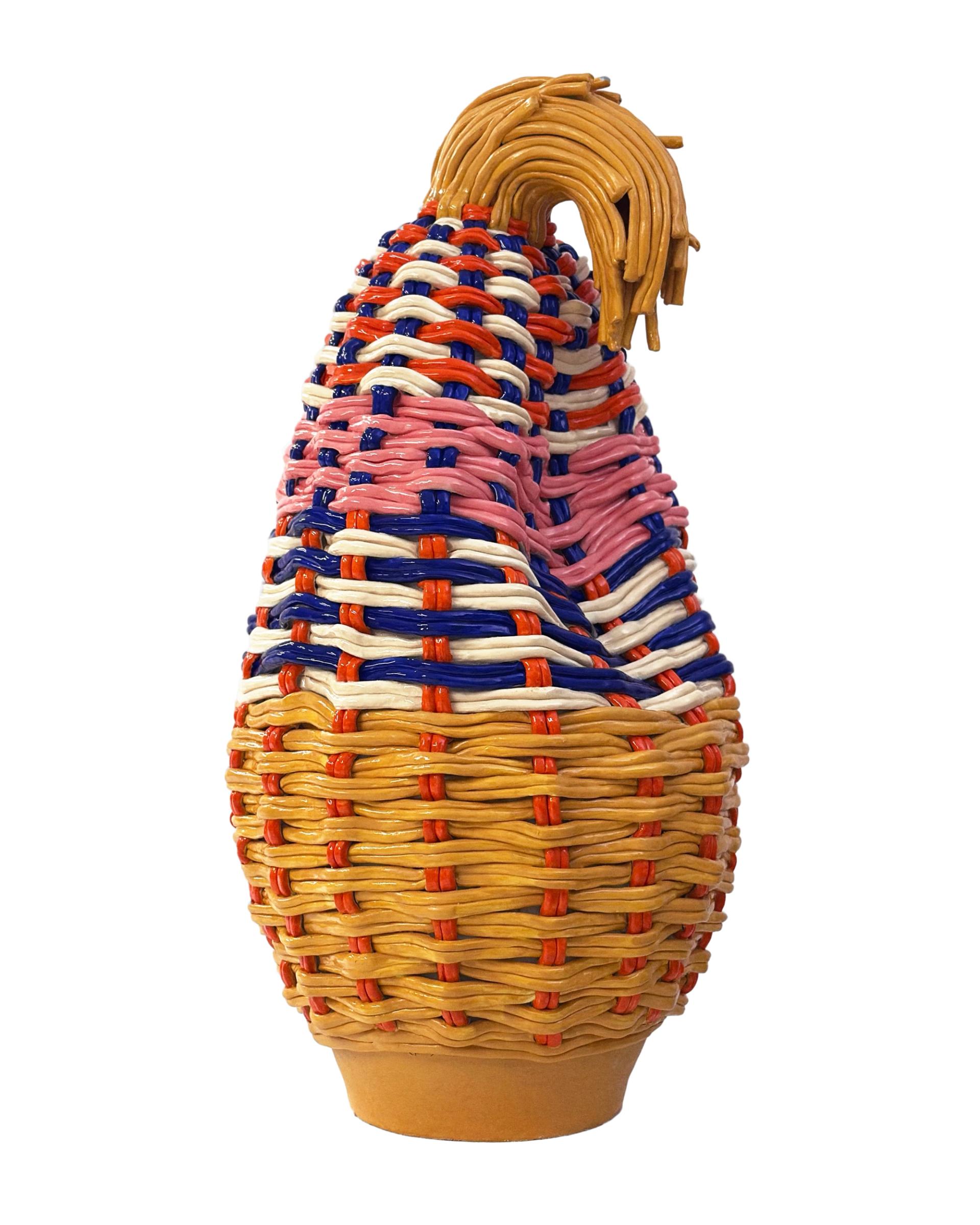 Glossy woven ceramic vessel in red, blue, cream, and pink basketlike pattern.