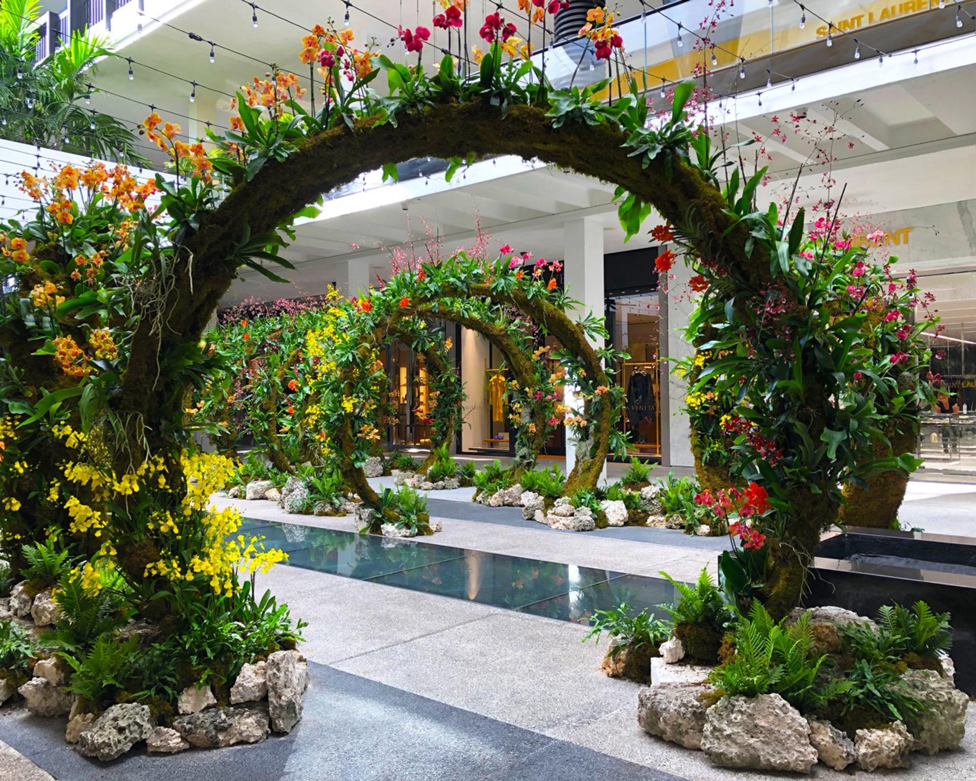 Rings of flowers in a shopping space.