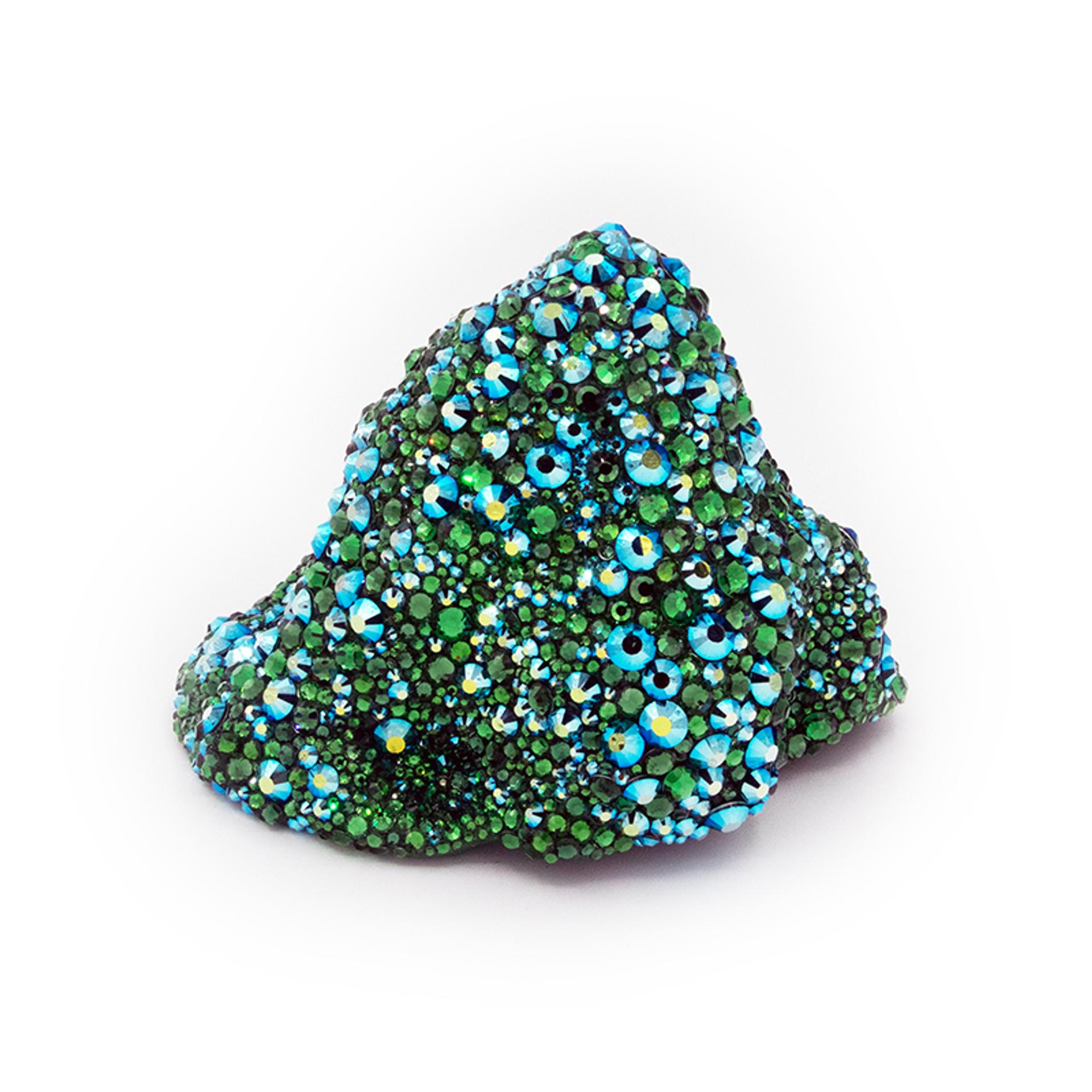 Abstract mound-shaped sculpture covered in blue and green iridescent crystals against white background.