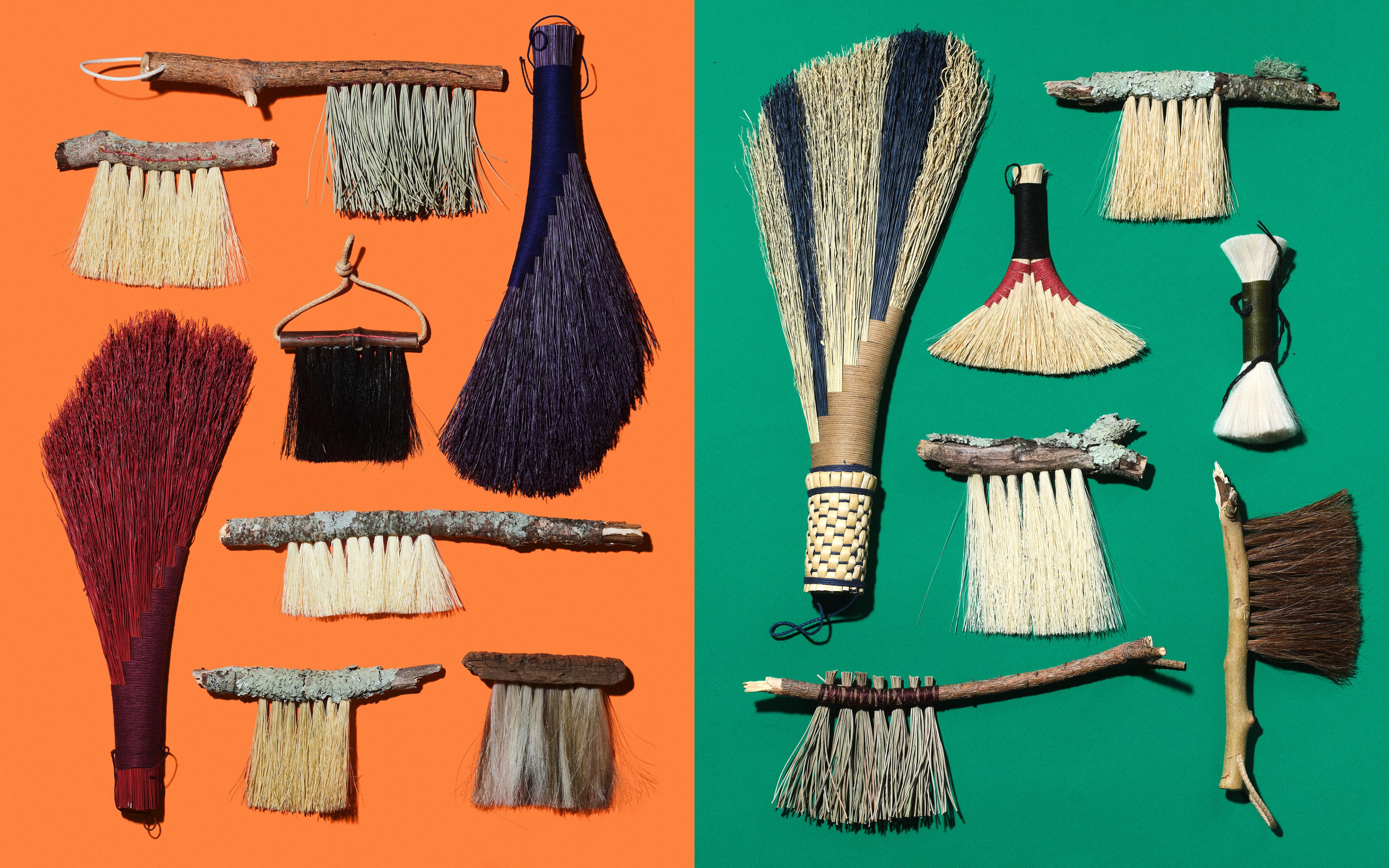 Handmade brooms and brushes with natural straw, red, blue, and black bristles bound to branch handles, arranged against orange and green backdrops.