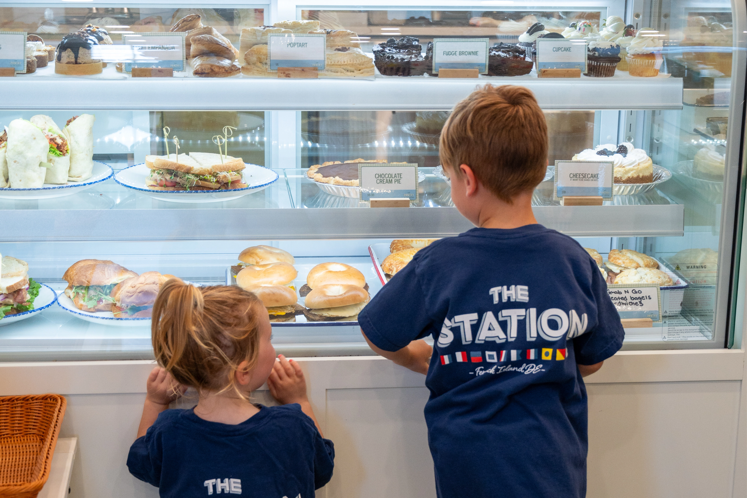 Kids at the pantry pastry case