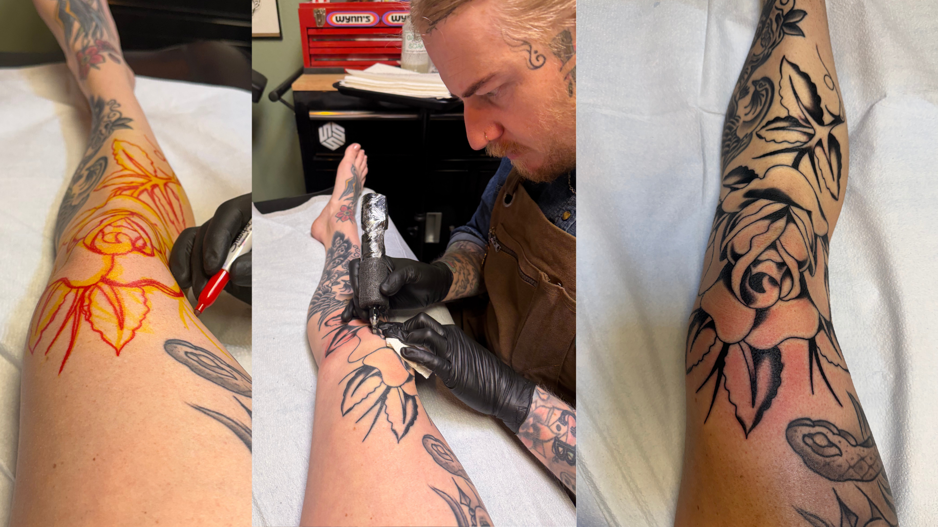 Three side-by-side photos documenting a freehand rose tattoo being added to a leg already covered in traditional-style tattoos, with no stencil used. Left: the rose outlined freehand directly on the skin in red and yellow marker. Center: a bearded, heavily tattooed artist in a brown apron and black gloves leans over the leg, tattooing the black outline of the rose with a tattoo machine; a red toolbox sits in the background. Right: the finished rose tattoo in close-up, with bold black outlines and red shading, set among the rest of the traditional tattoo sleeve covering the leg.