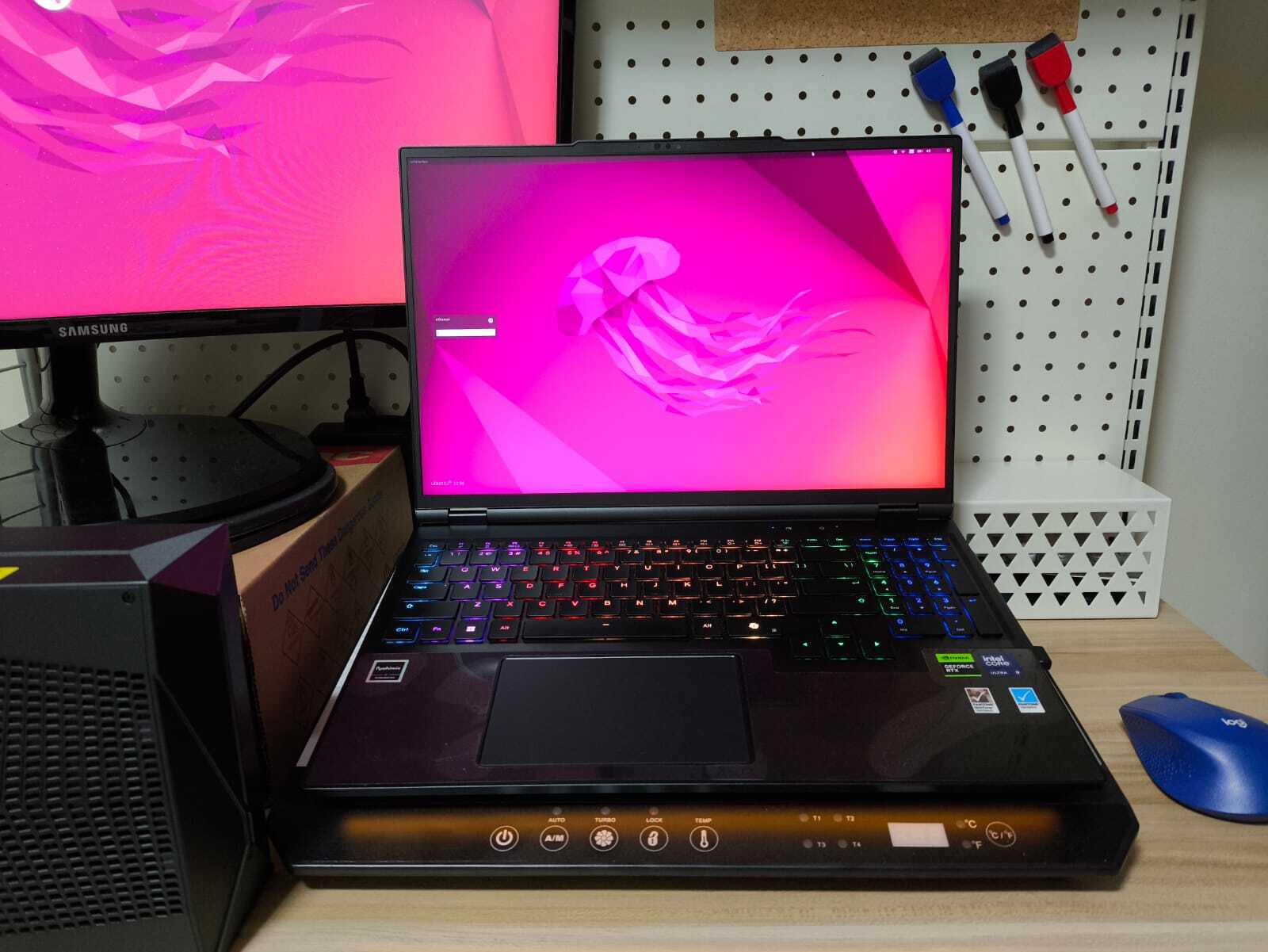 Laptop showing pink jellyfish ubuntu log in screen