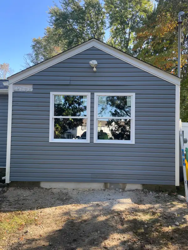 Garage Door Opening Framed In & Full Exterior Renovation — Vinyl Siding, Tyvek House Wrap & Double Window Installation | Howell, NJ