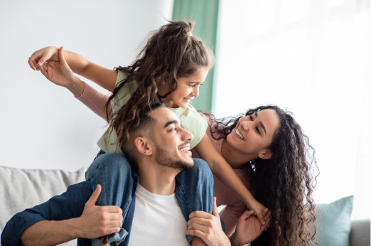 Husband and wife interacting with child