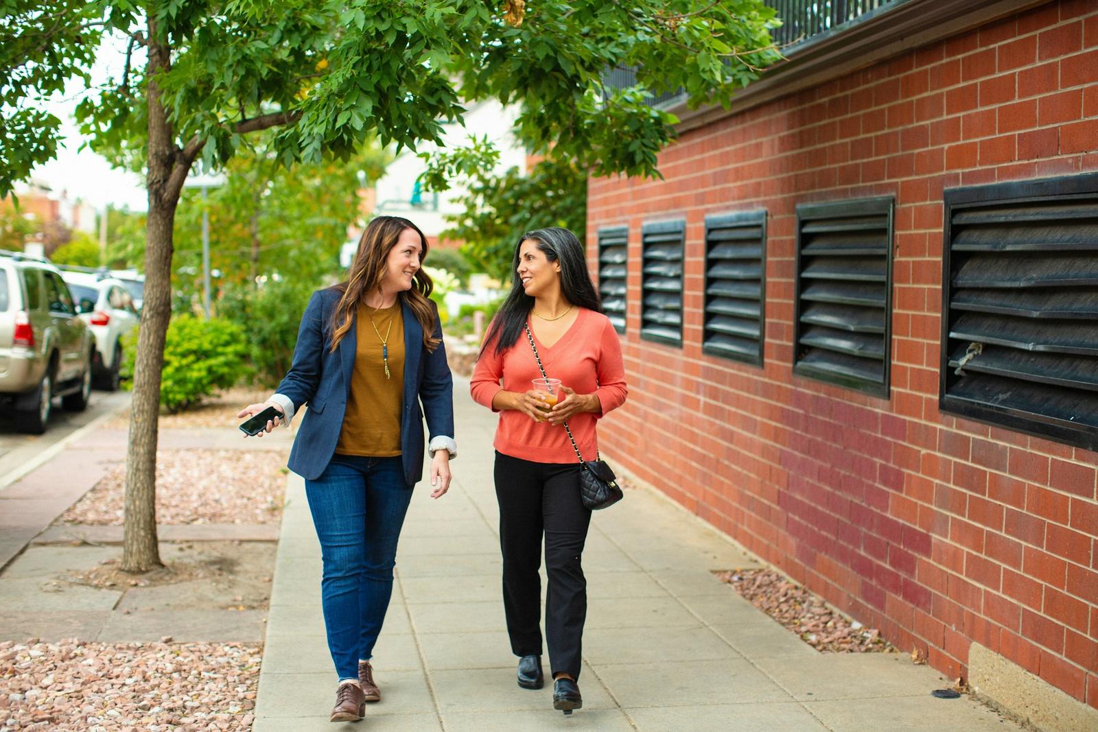Two friends walking in conversation