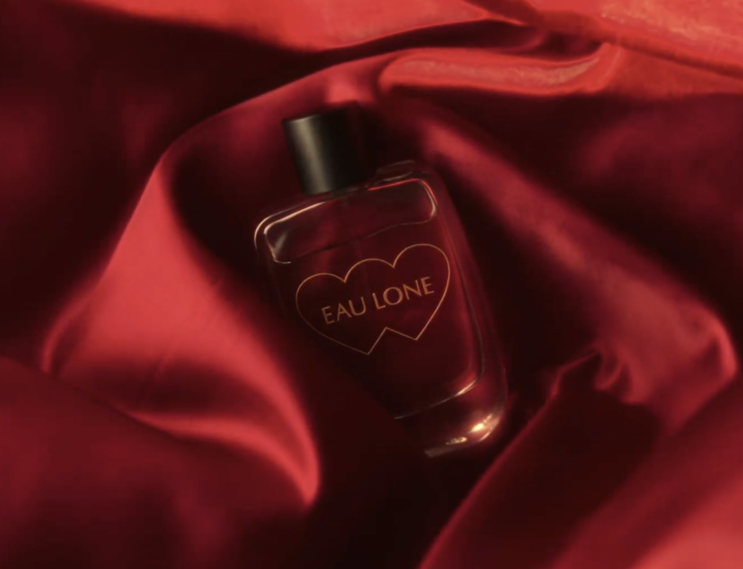 Masked figure with glowing heart-shaped eyes; text reads “Romance is dead – Heart Eyes.”
