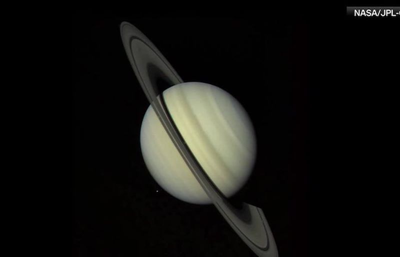 Saturn glows beside October's Hunter's Moon as the ringed planet nears peak visibility