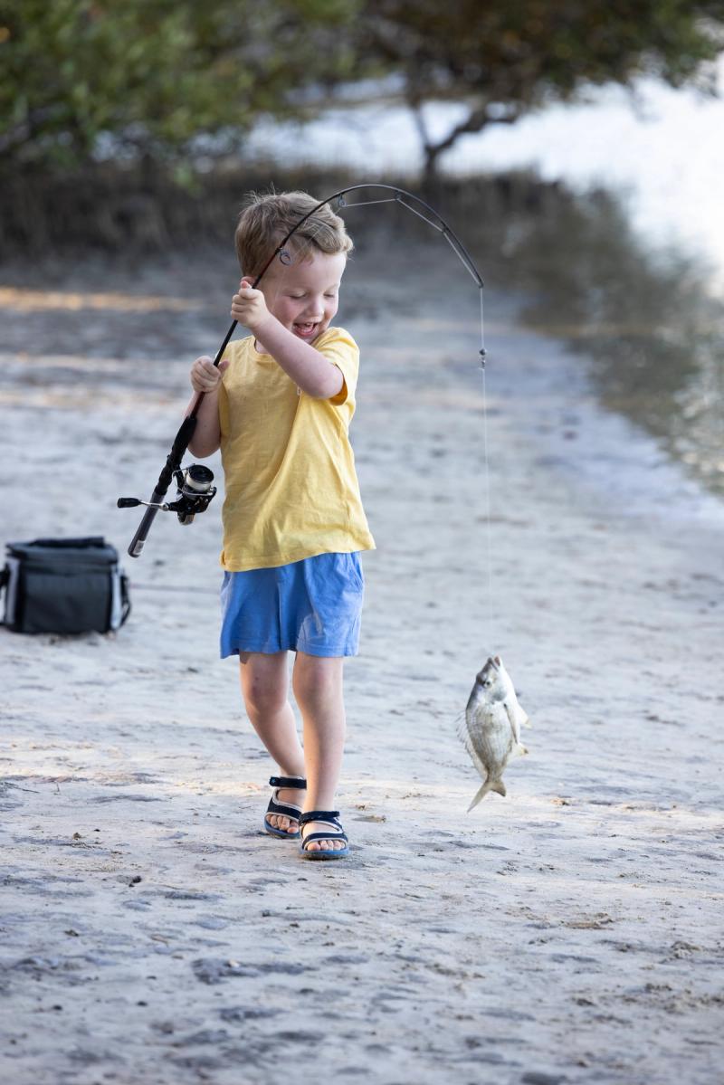 Young boy fishing in Ballina