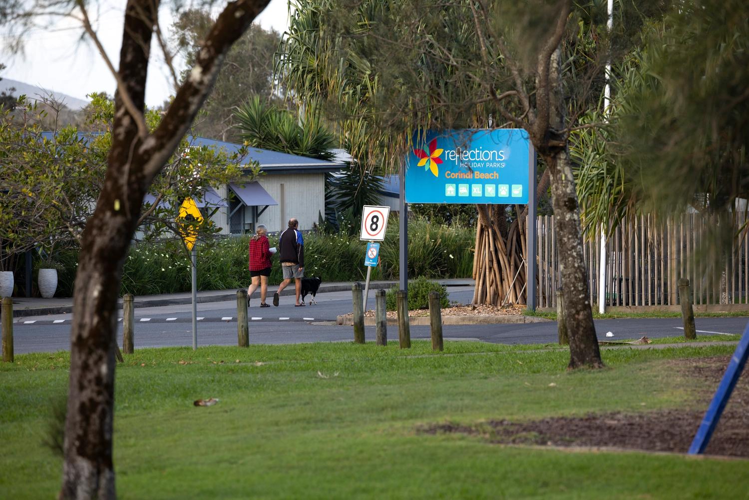 People walking too available kiosks at a reflections holiday park