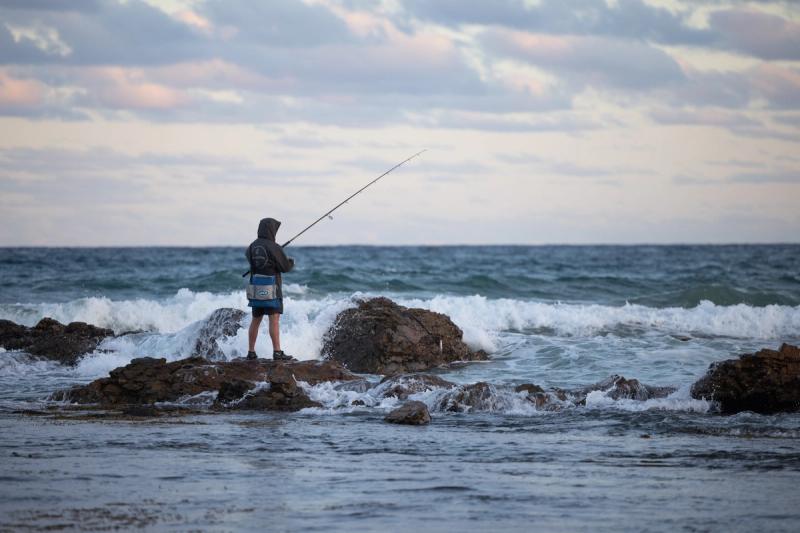 Man fishing in Corindi Beach