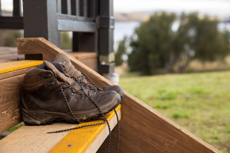 Hiking boots at a lake glenbawn location